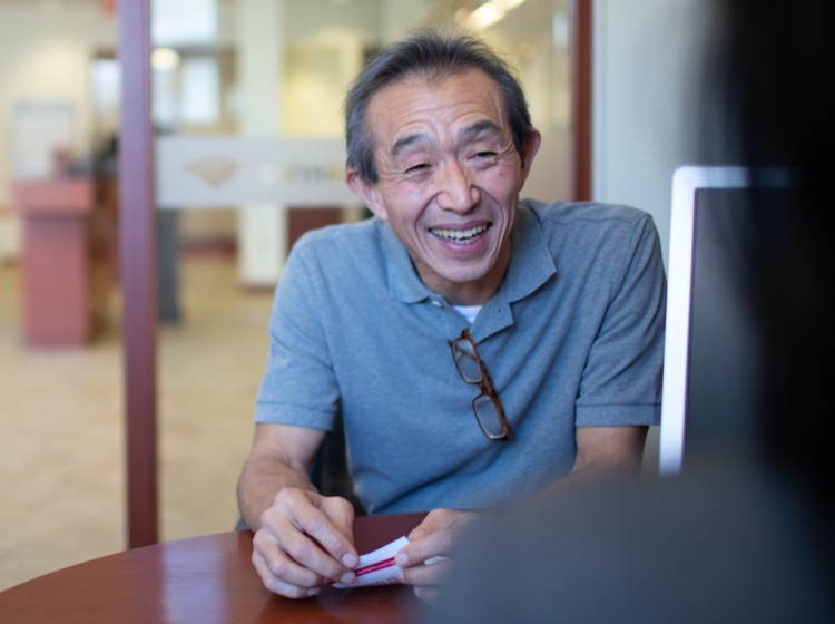 Man smiling in office